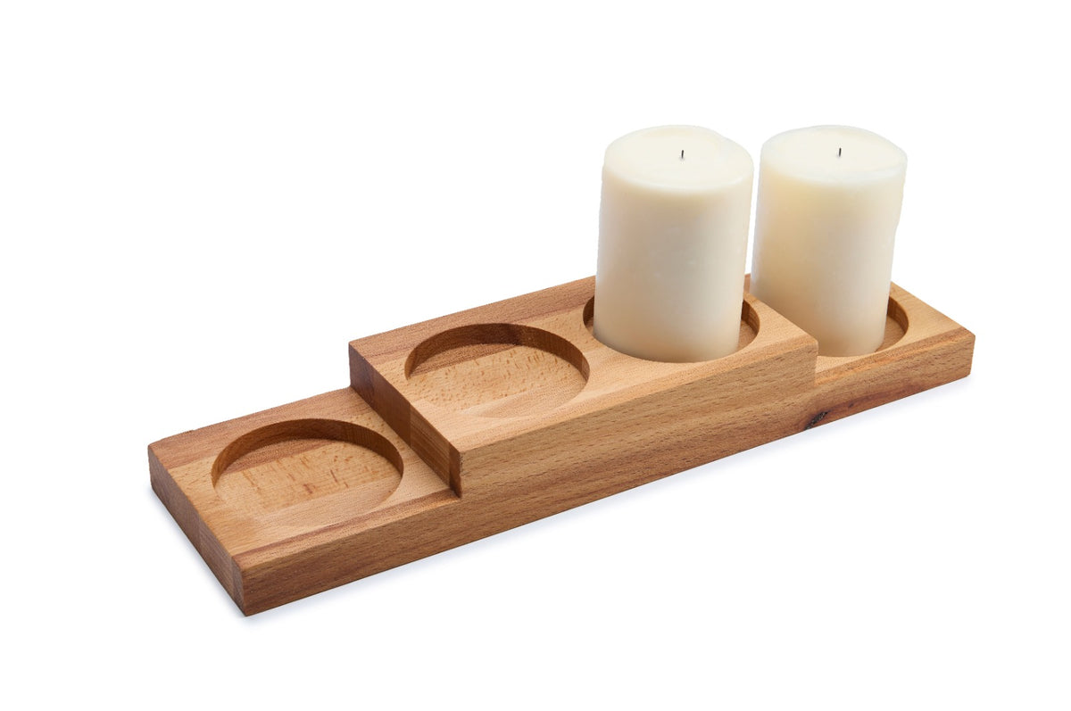 Rectangular beech wood candle holder with four slots for tealights or pillar candles. A warm, natural decorative piece for dining tables, living rooms and Advent decorations. Made from solid oiled beech. Size: 330 x 90 x 40 mm.