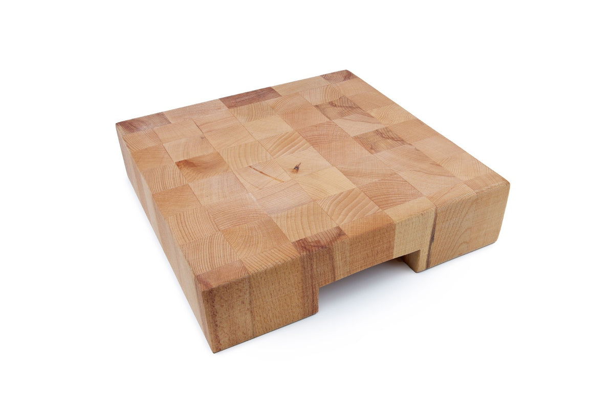 Professional end grain beech wood butcher block with side slots for easy handling. End grain construction is extremely durable, self-healing and keeps knives sharp longer. Ideal for chefs, butchers and serious home cooks. Size: 290 x 290 x 70 mm.