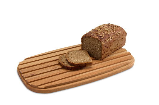 Oval beech wood bread cutting board, perfect for slicing loaves, baguettes and serving bread at the table. Solid oiled beech is sturdy, knife-friendly and naturally hygienic. Size: 350 x 200 x 20 mm.