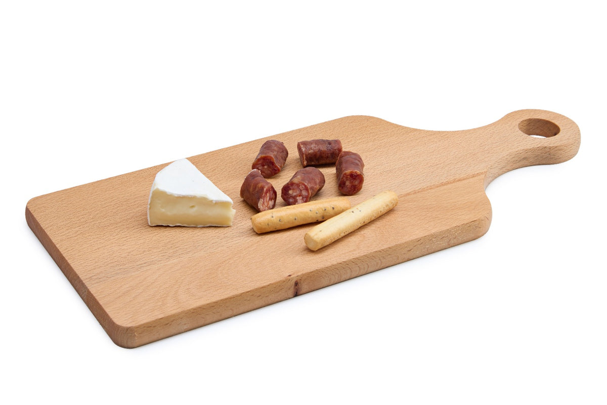 A slim rectangular beech wood cutting board with a practical handle, perfect for everyday chopping of herbs, fruit and vegetables or for serving bread and cheese. Made from solid, oiled beech wood that is gentle on knives and naturally hygienic. Lightweight and easy to hang and store. Size: 340 x 140 x 13 mm.
