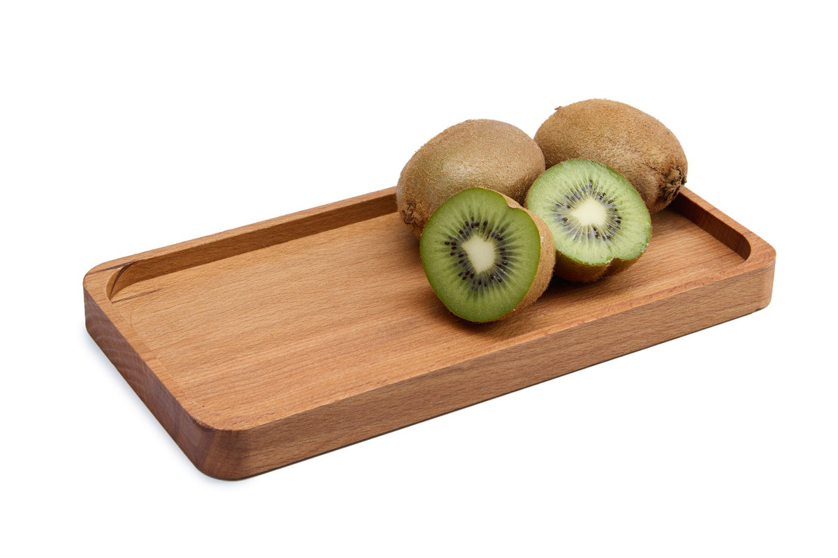 Small rectangular beech wood tray for serving snacks, sweets, spices or coffee cups. Made from solid oiled beech with a smooth, natural finish. Also great as a decorative organizer. Size: 250 x 130 x 20 mm.