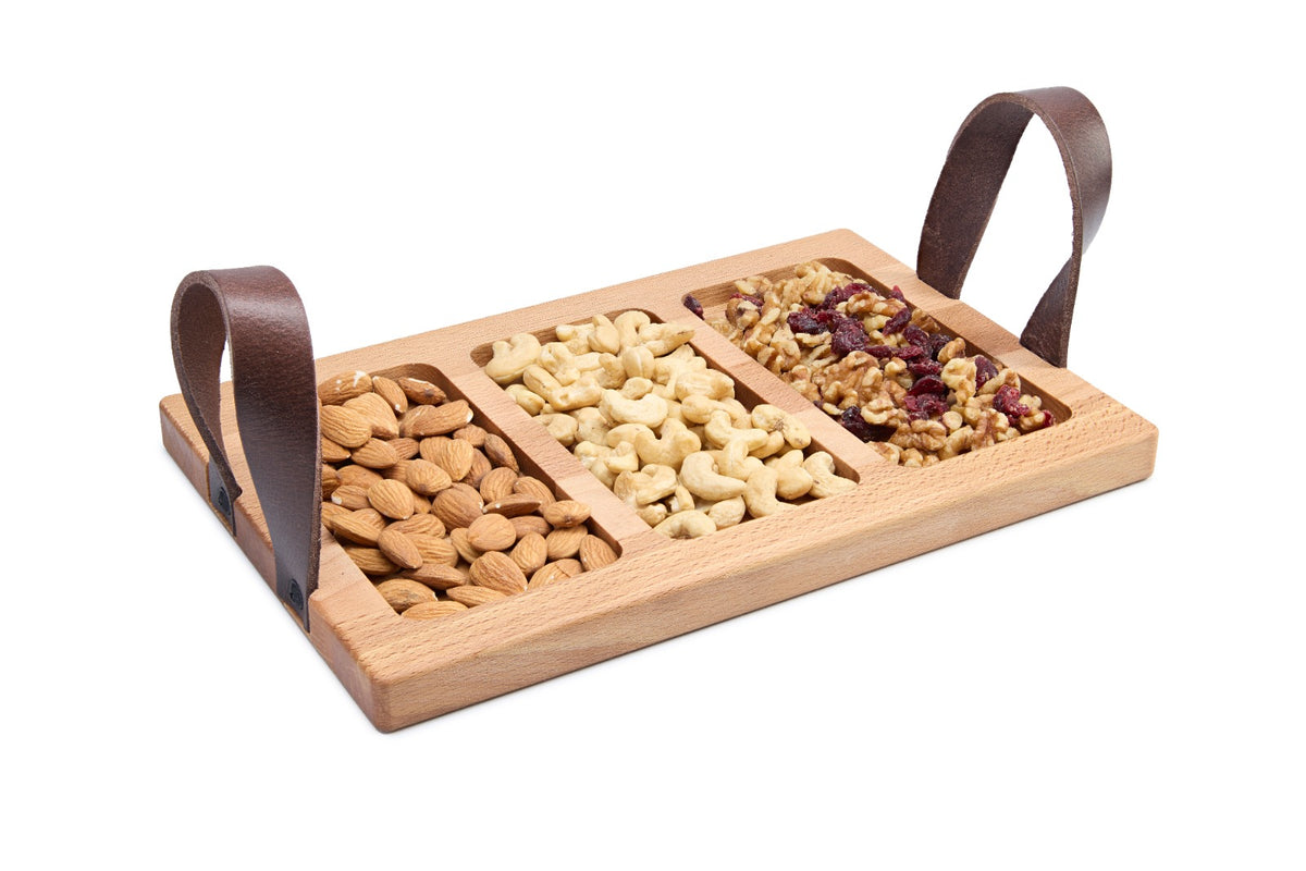 Beech wood serving tray with leather handles and three cut-outs for sauces, dips or small bowls. Ideal for tapas, snacks and appetizers. Solid oiled beech, durable and food-safe. Size: 305 x 195 x 20 mm.